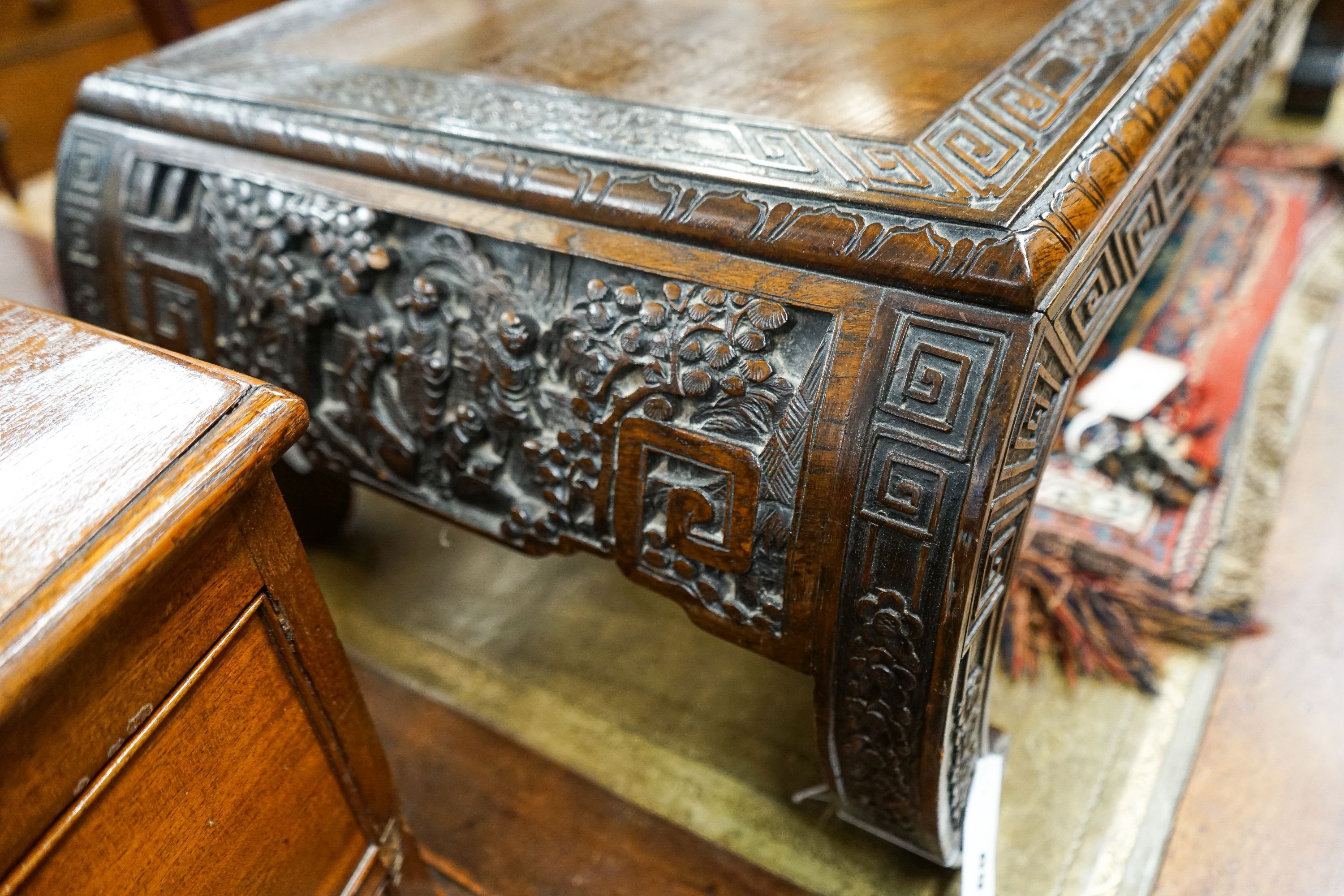 A Chinese rectangular carved top hardwood table, width 104cm, depth 46cm, height 29cm